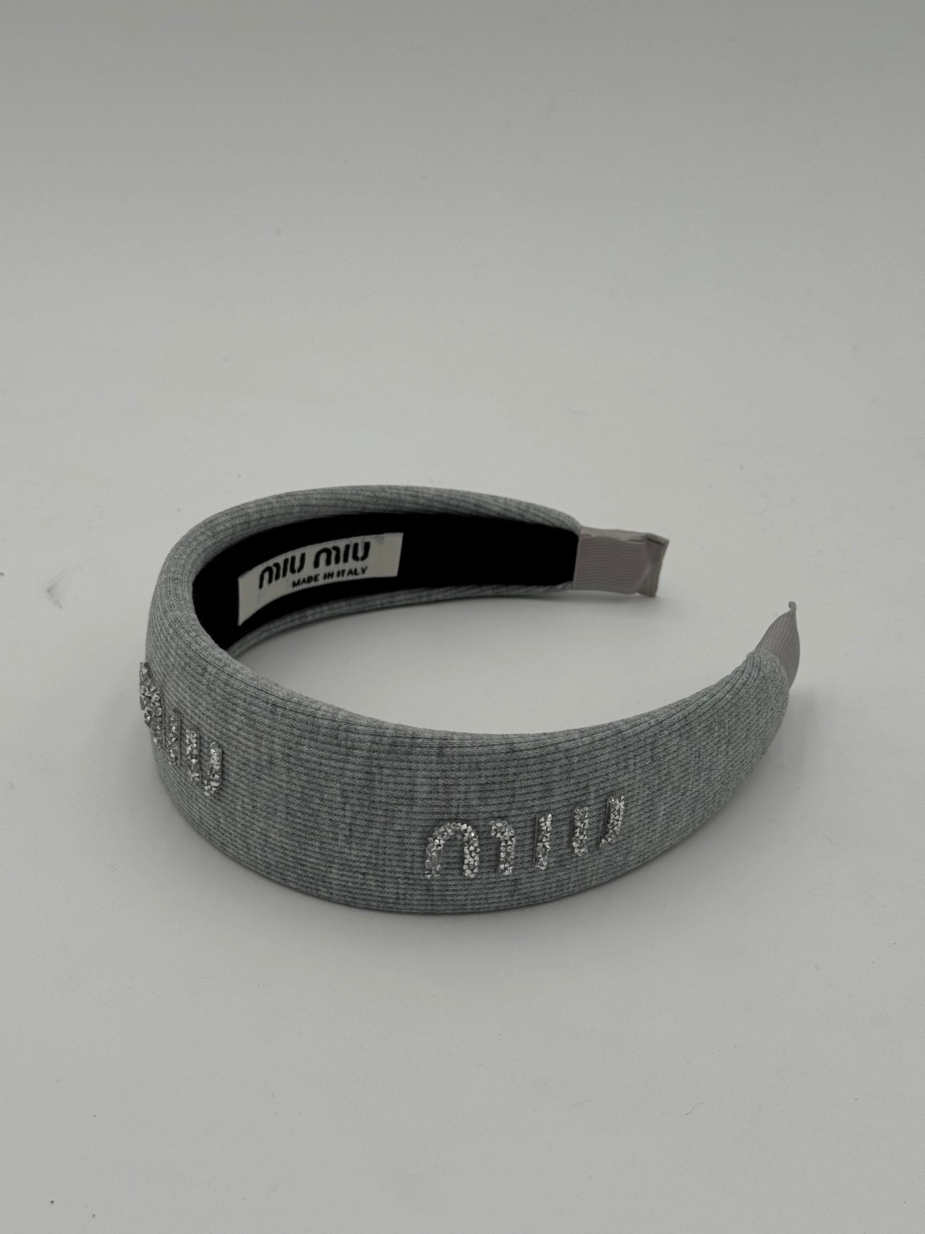 Cerchietto text grigio chiaro
